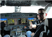 Man Gives Thumbs Up from Cockpit