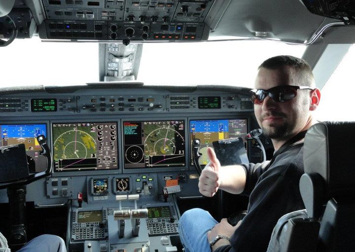 Man Gives Thumbs Up from Cockpit
